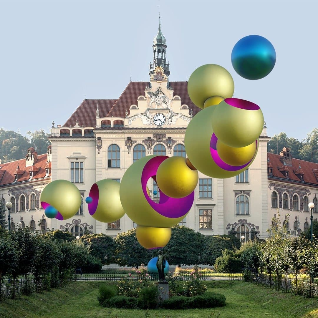 Mechanical Galaxy by Jan Kaláb, golden and blue AR spheres floating in front of a historic building on Lyčkovo náměstí